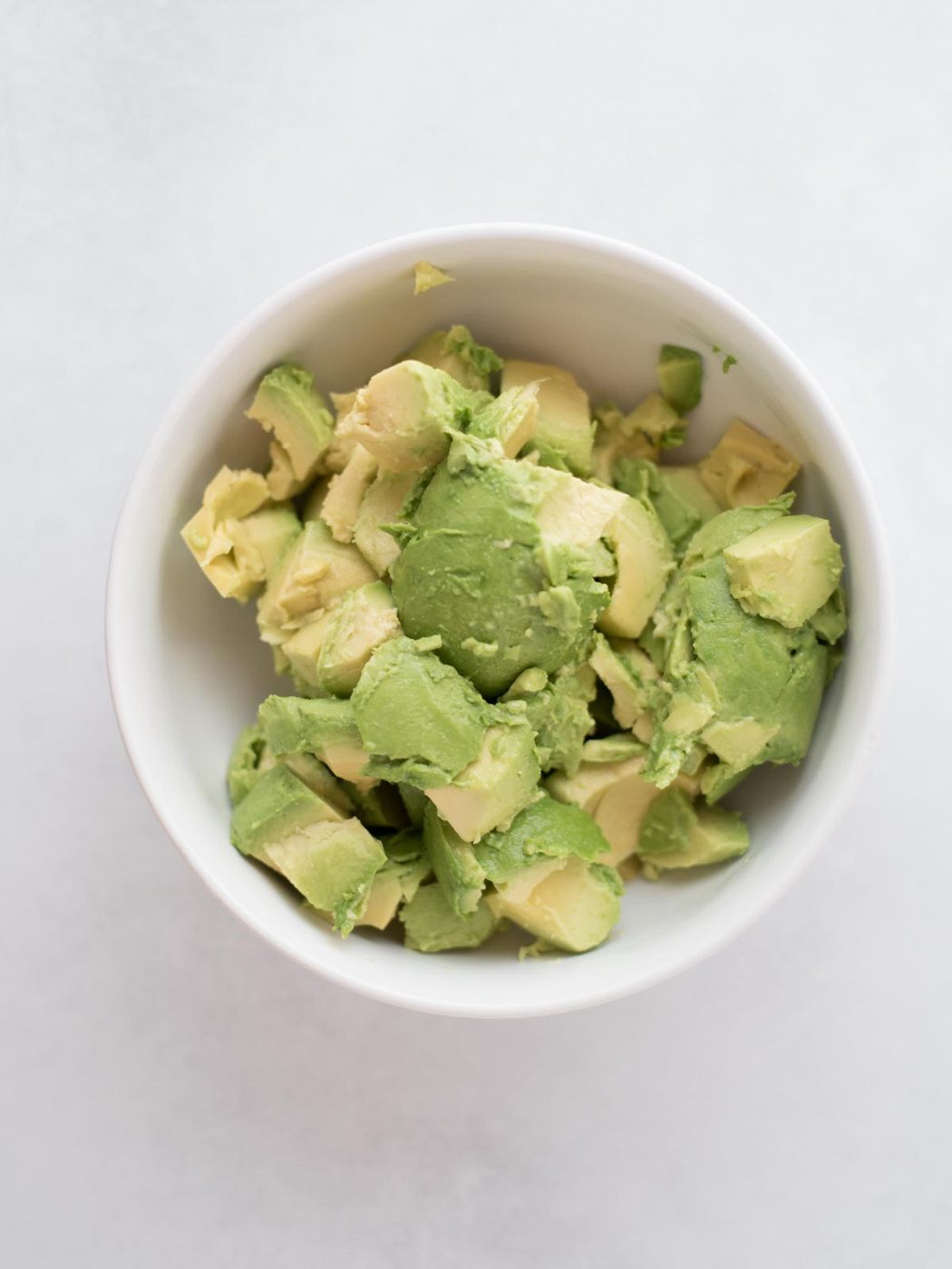 Chopped avocado in a bowl.