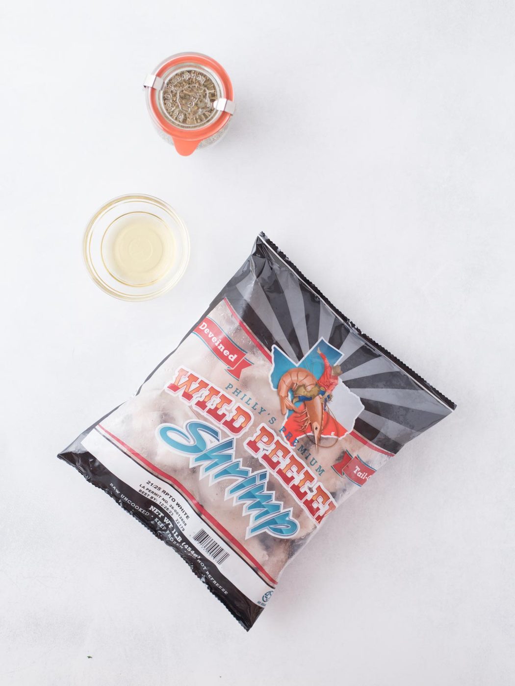 Ingredients shown used to make air fryer frozen shrimp.