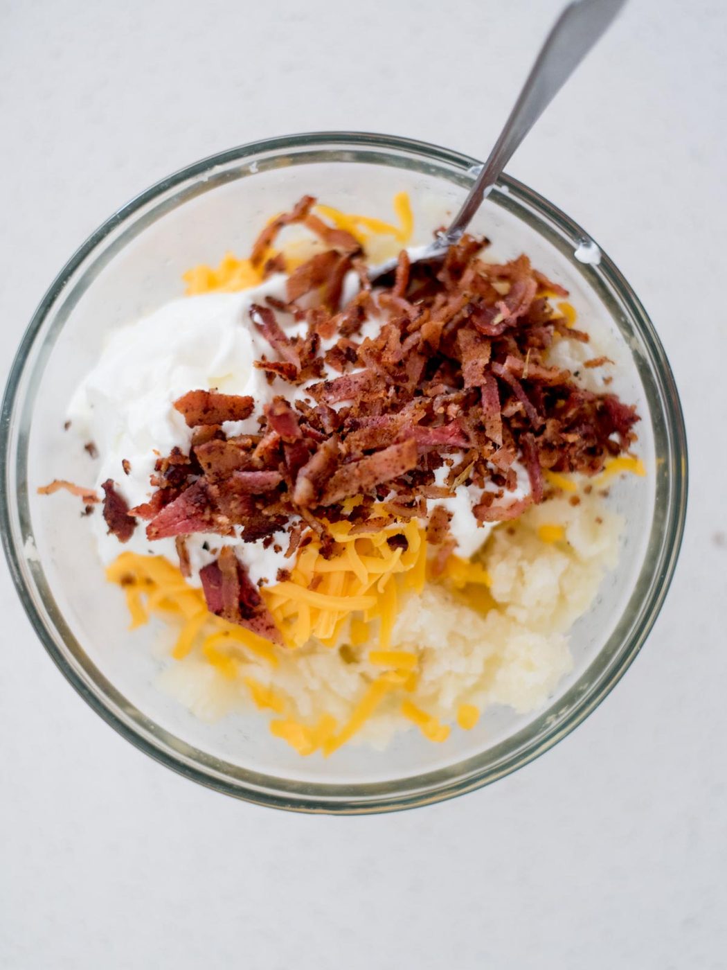 Ingredients added to a mixing bowl to make the potato filling.