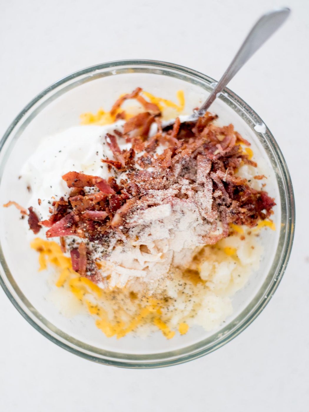 Seasoning added to the ingredients added to a mixing bowl to make the twice baked potatoes filling.