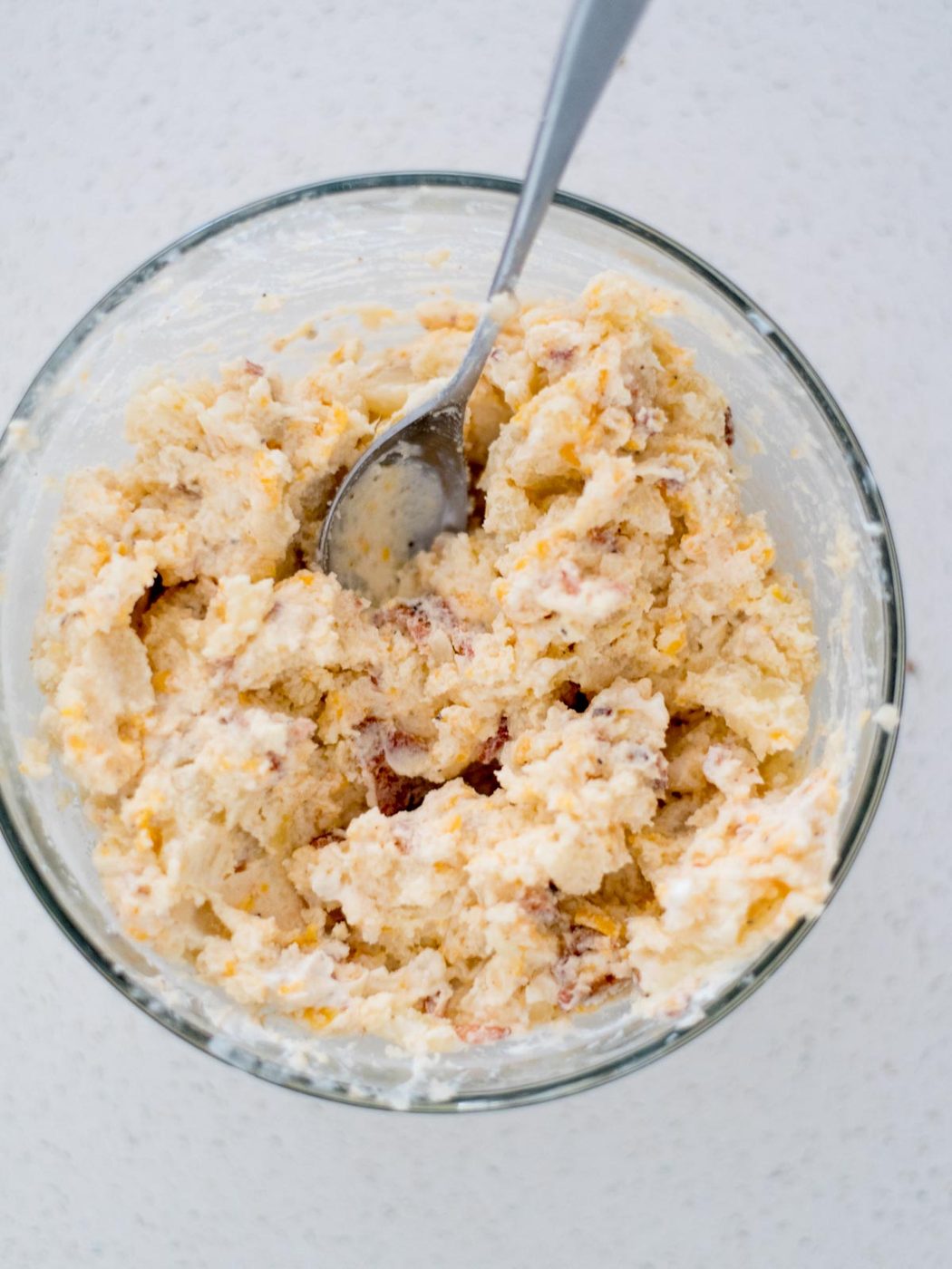 Mixing bowl with the potato mixture for twice baked potatoes ready to use.