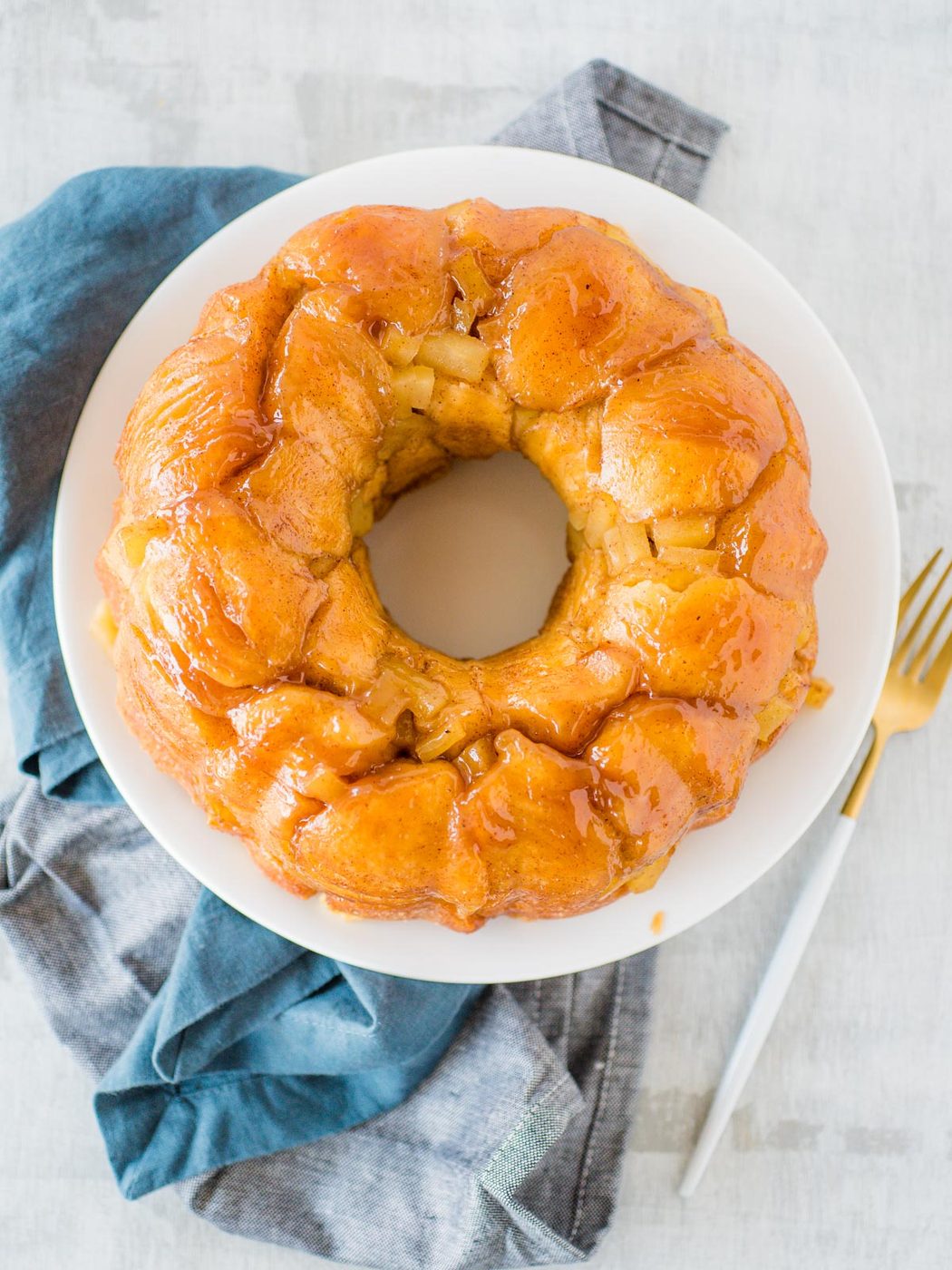 apple cinnamon monkey bread on a white plate