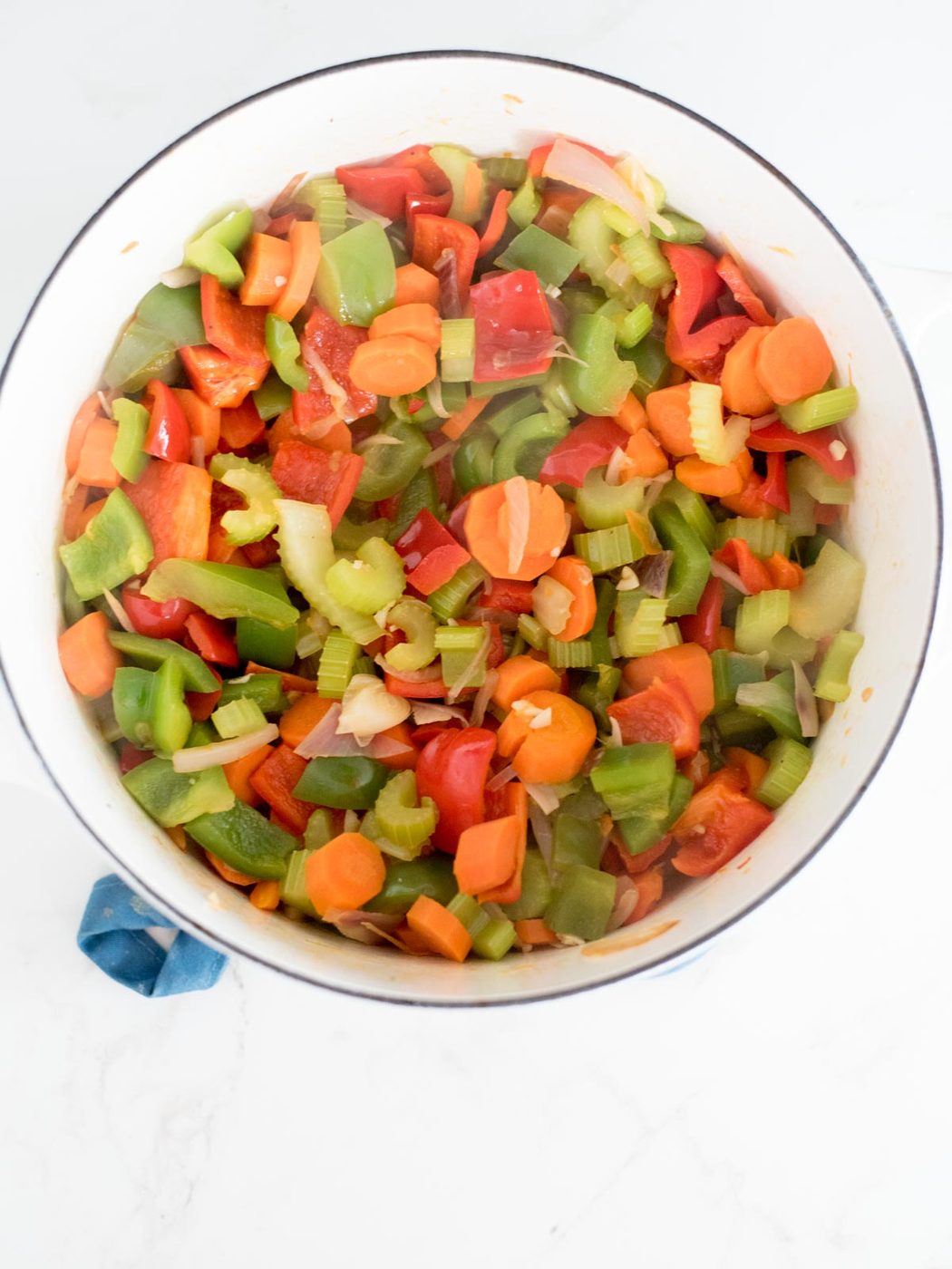 wine added to the dutch oven with the vegetables