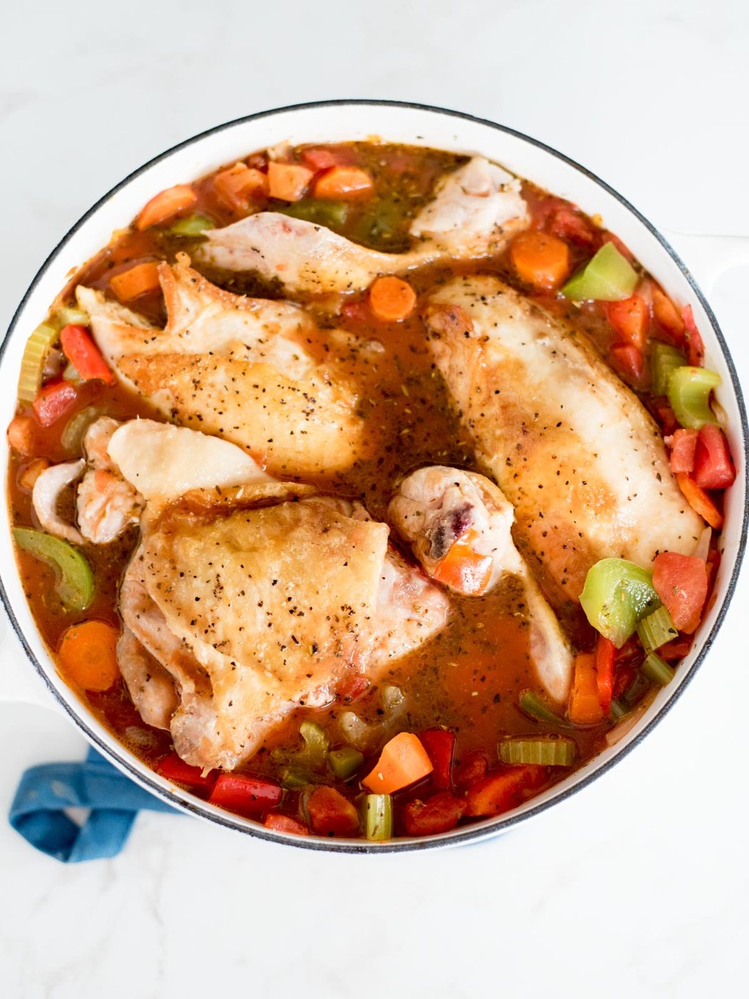 chicken added back into the dutch oven with the vegetables