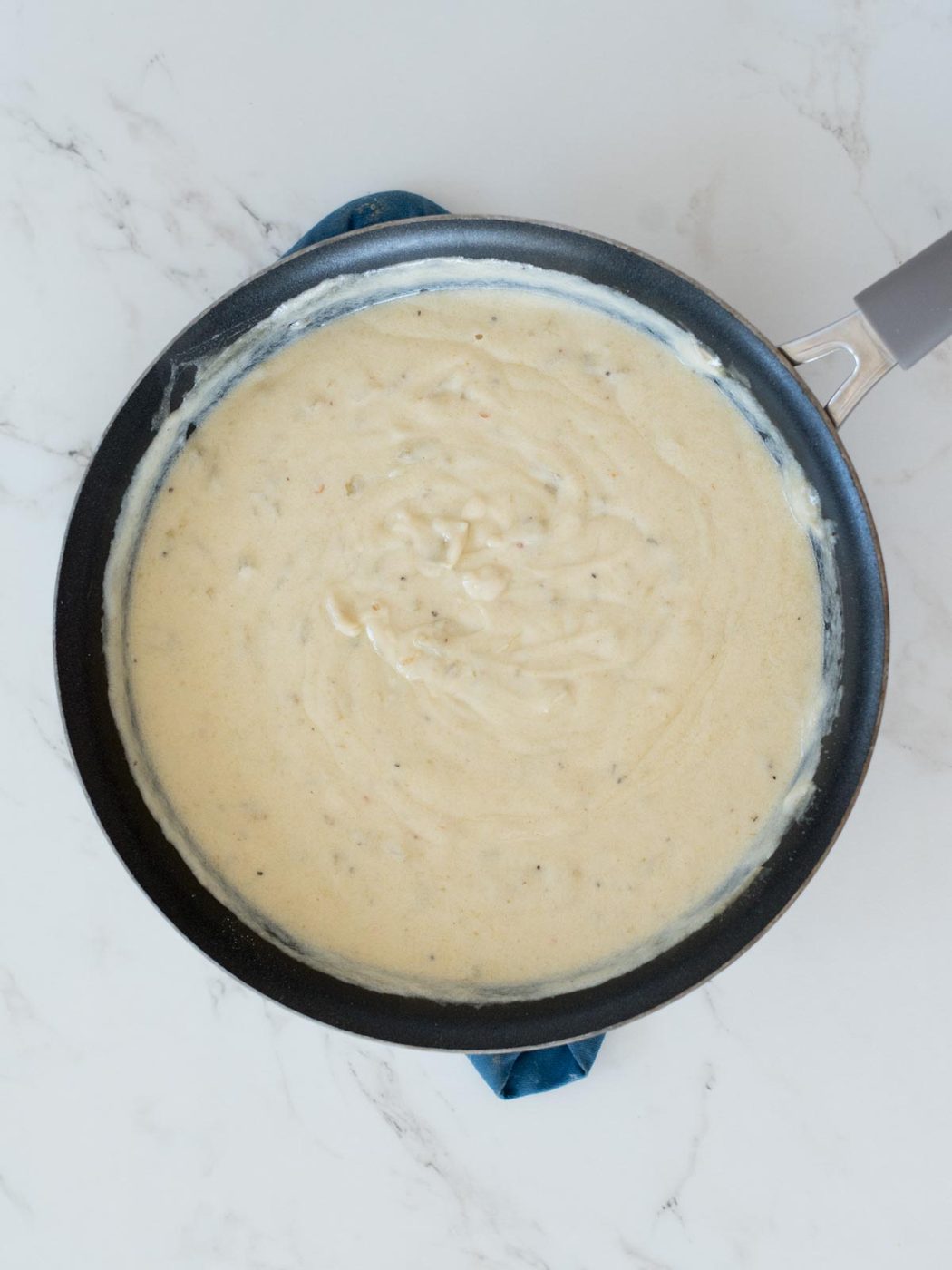 green chile enchilada sauce in a skillet