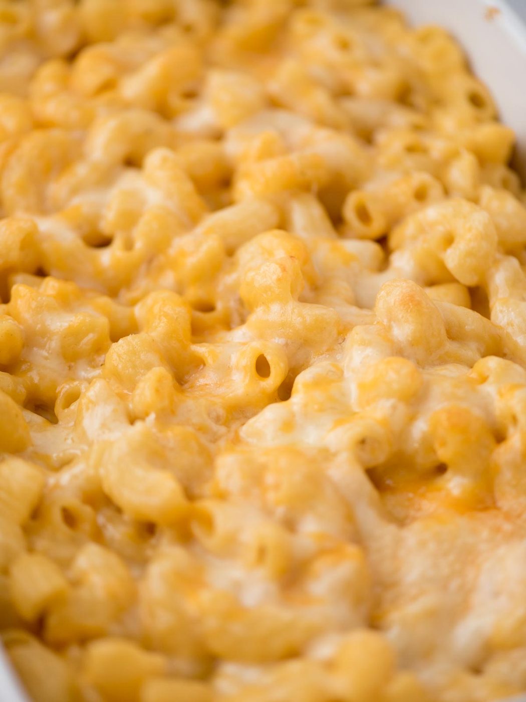 Close up of cheesy baked mac and cheese.