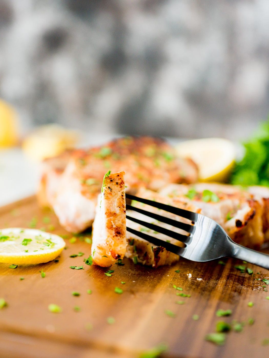 piece of baked ranch pork chops on a fork