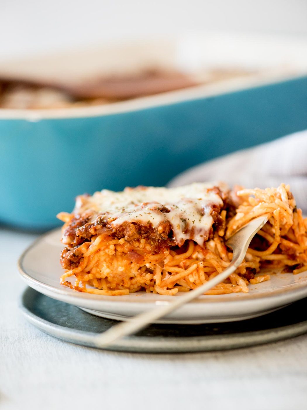 straightforward baked spaghetti on a plate with a fork