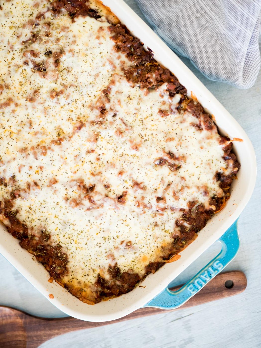 oven-baked spaghetti in a staub casserole dish