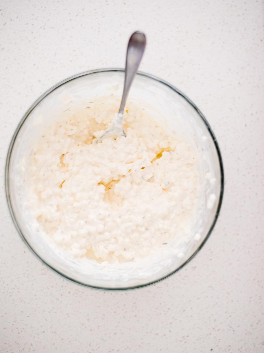 cream cheese and cottage cheese mixed together in a bowl
