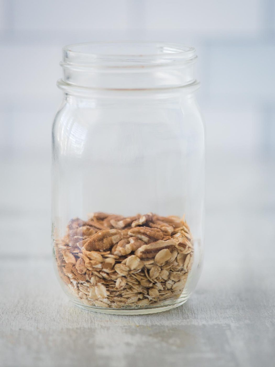 pecans added to jar of ingredients