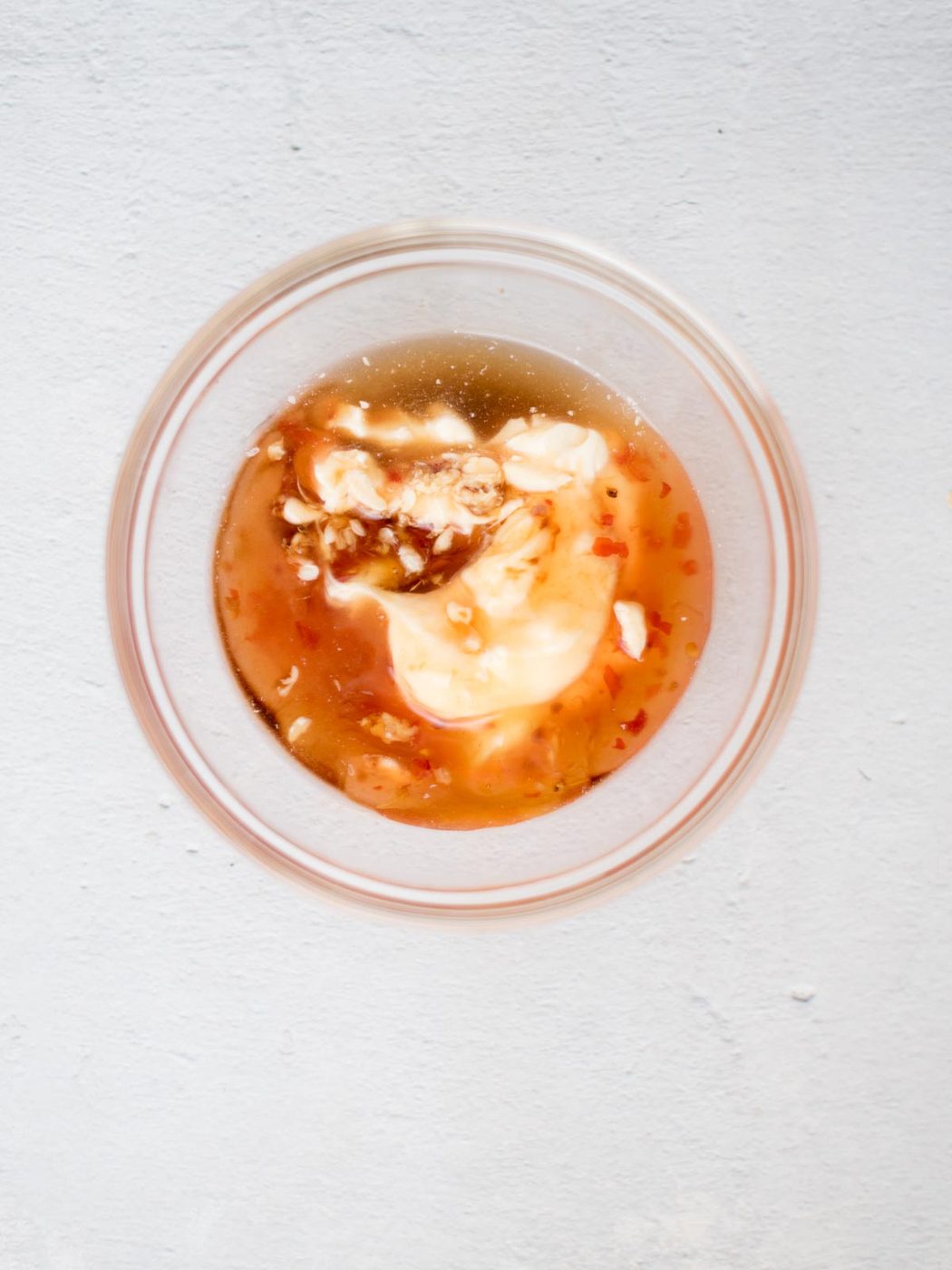 bang bang sauce ingredients in a mixing bowl