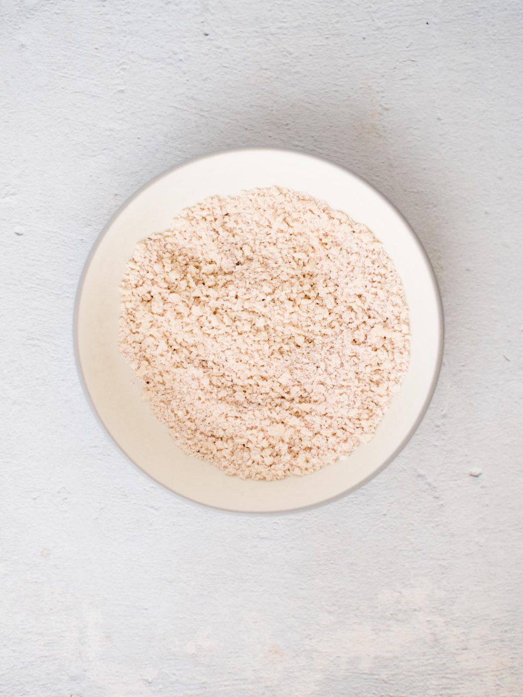 Seasoned breadcrumbs in a bowl.