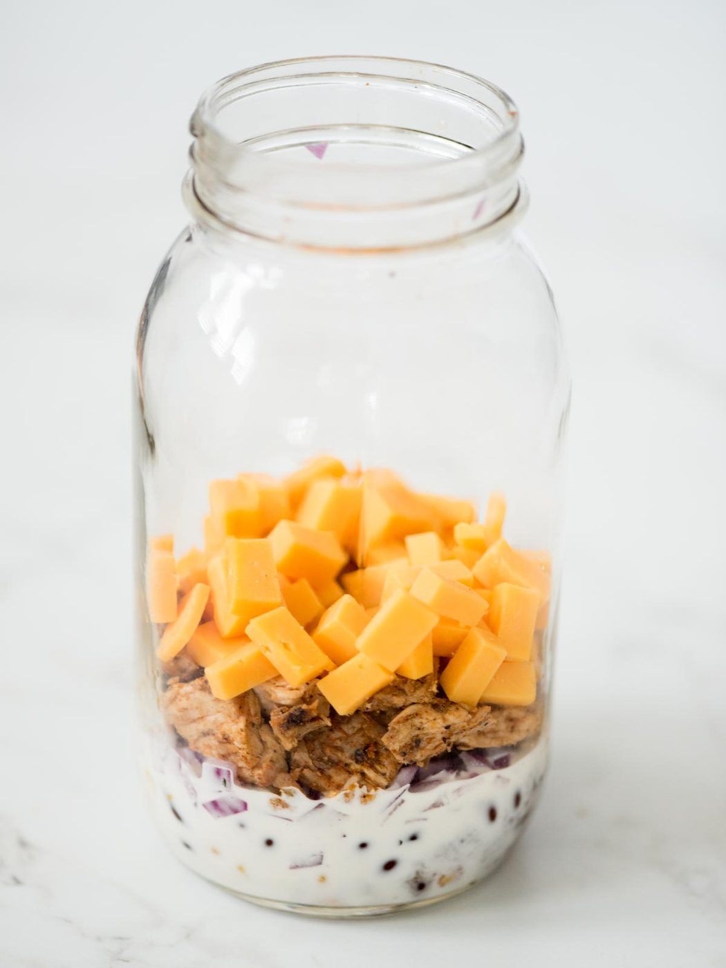 cheese added to the mason jar