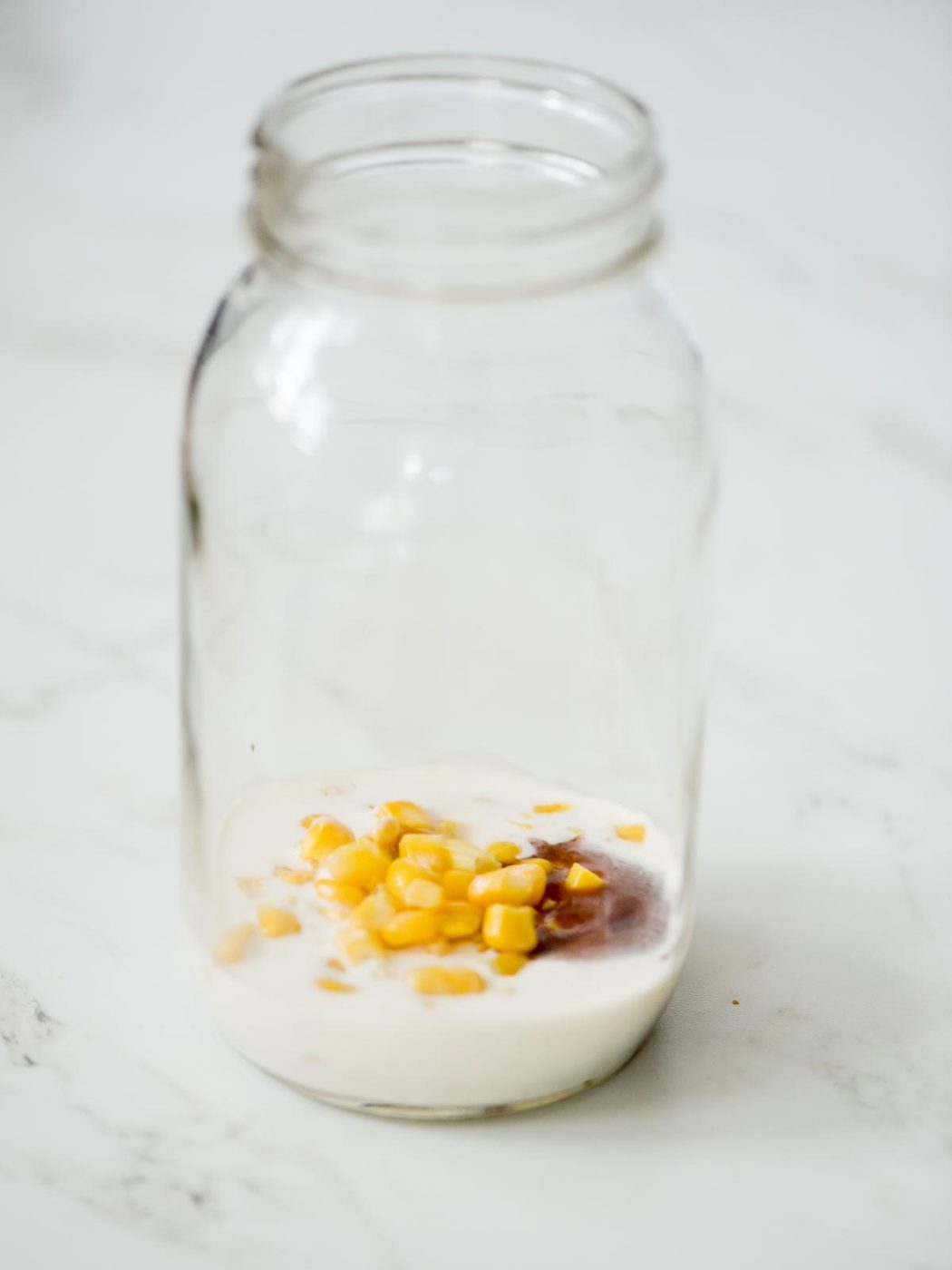 corn added to the mason jar