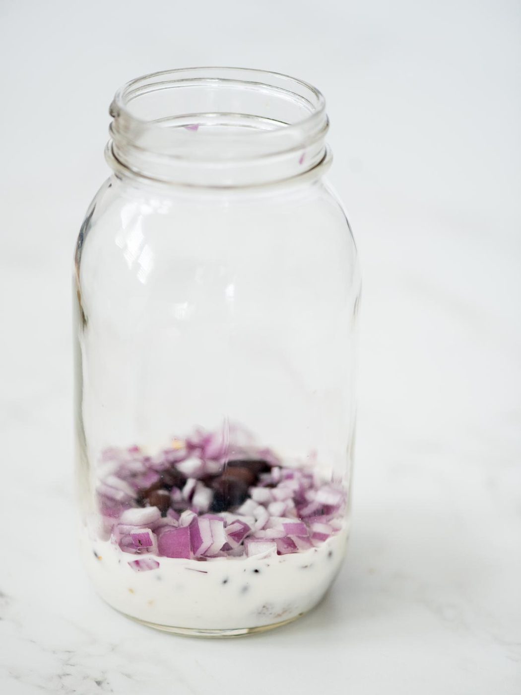 red onion added to the mason jar