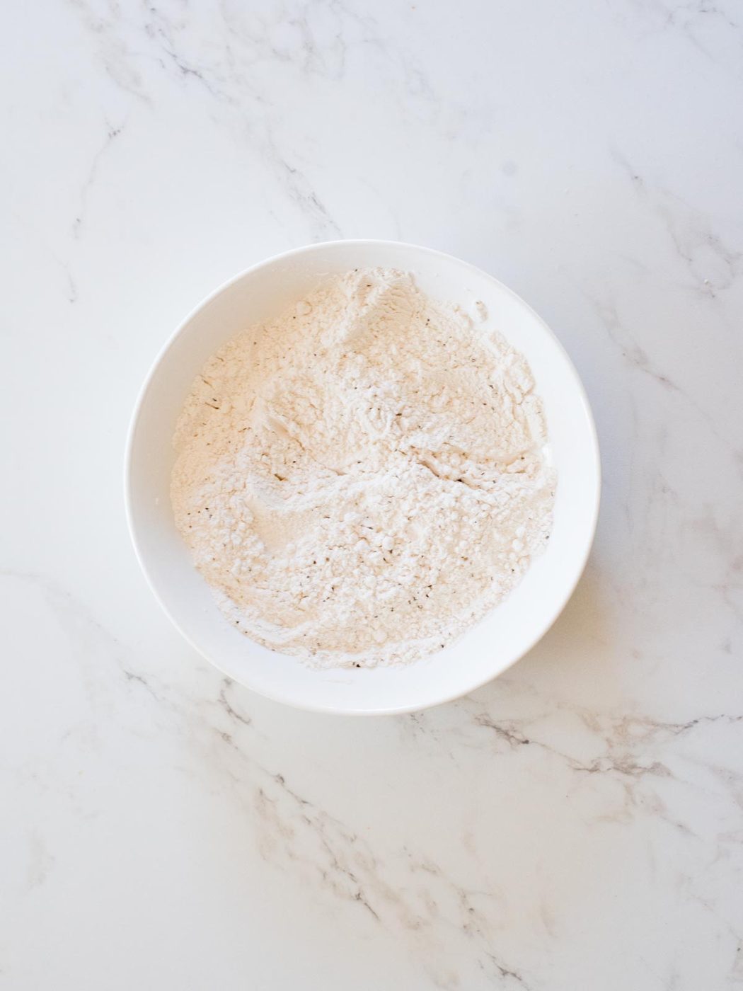 flour and black pepper combined in a bowl