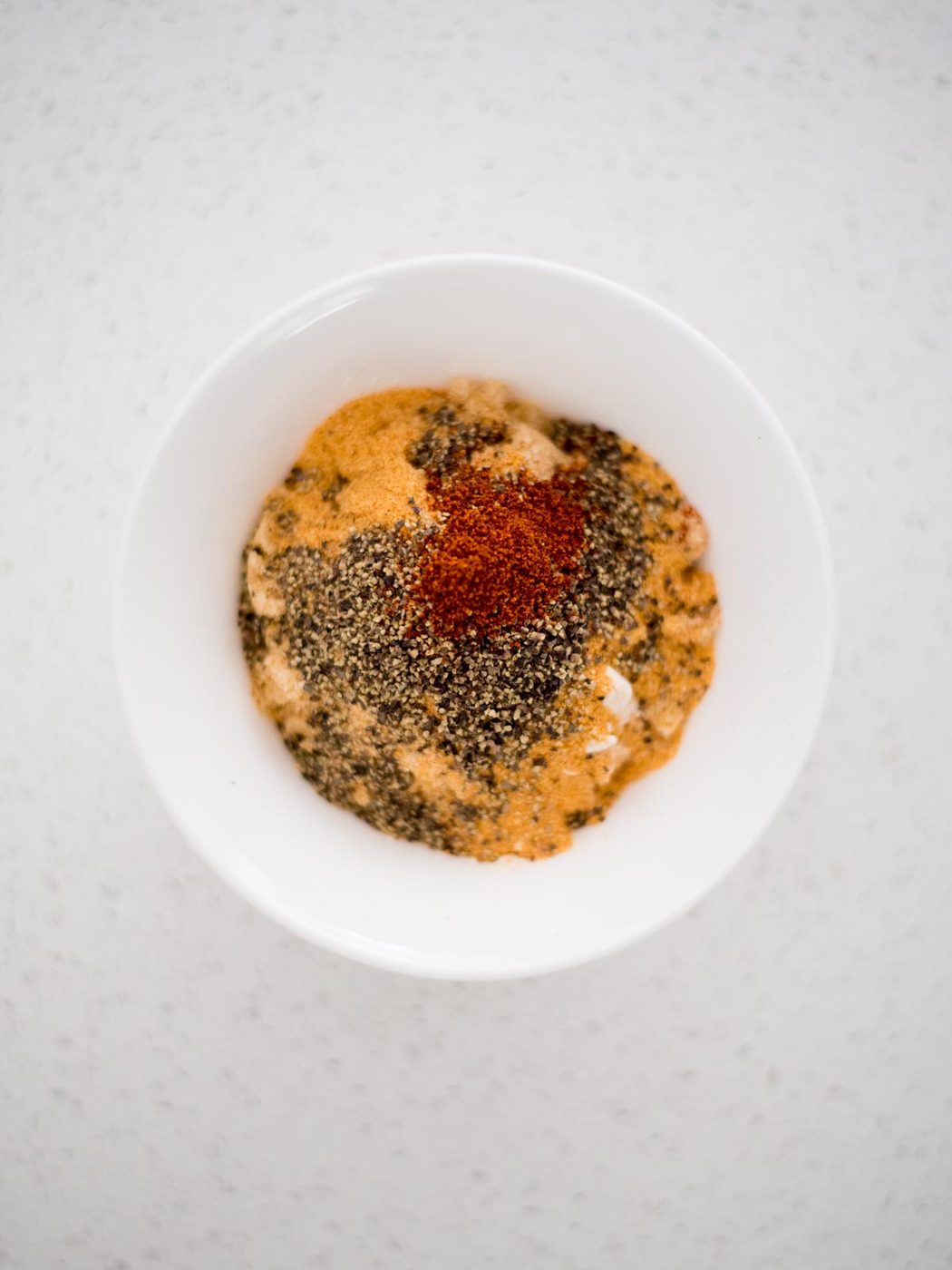 poultry dry rub ingredients in a small mixing bowl