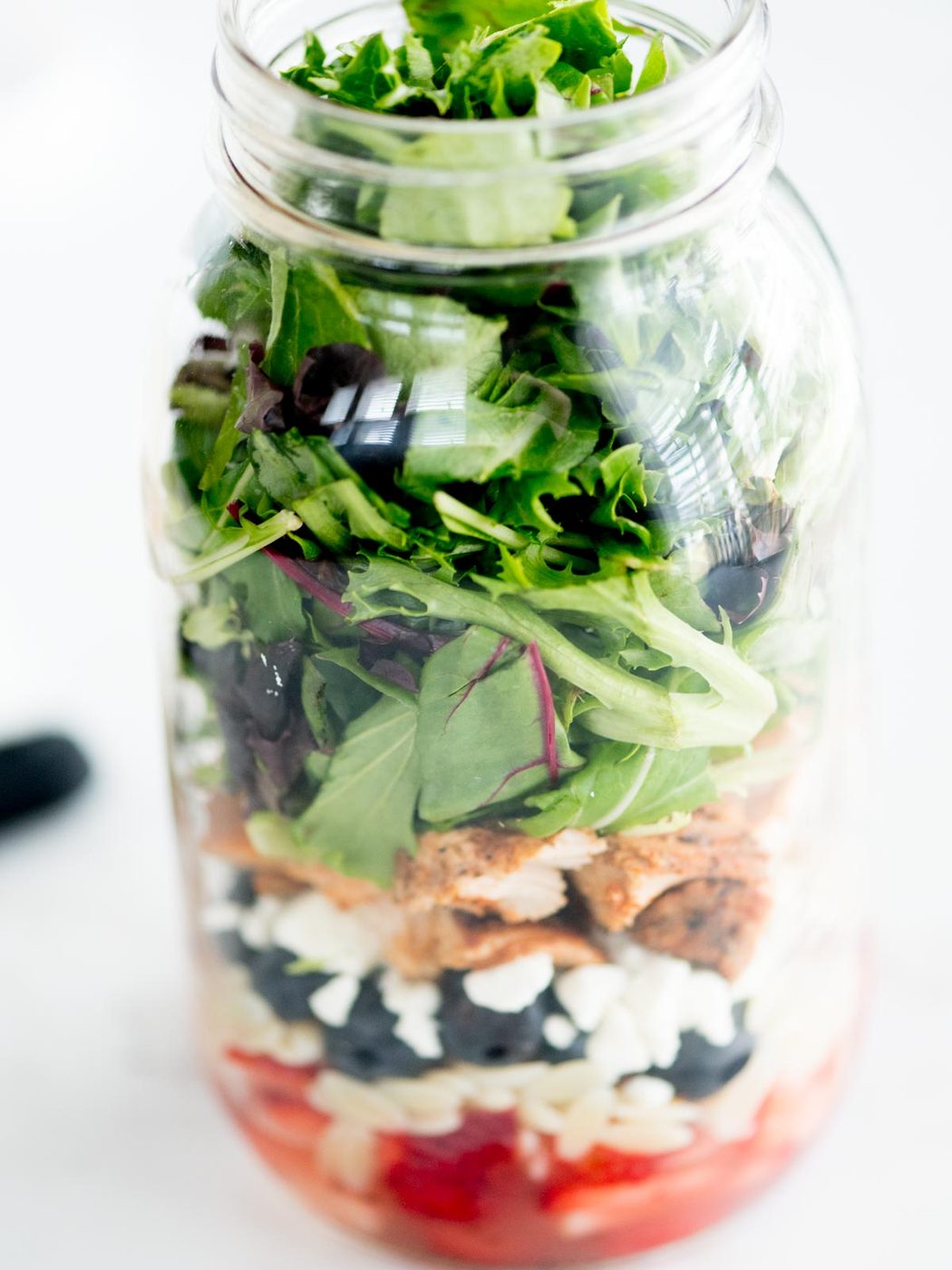 greens added to mason jar with rest of ingredients
