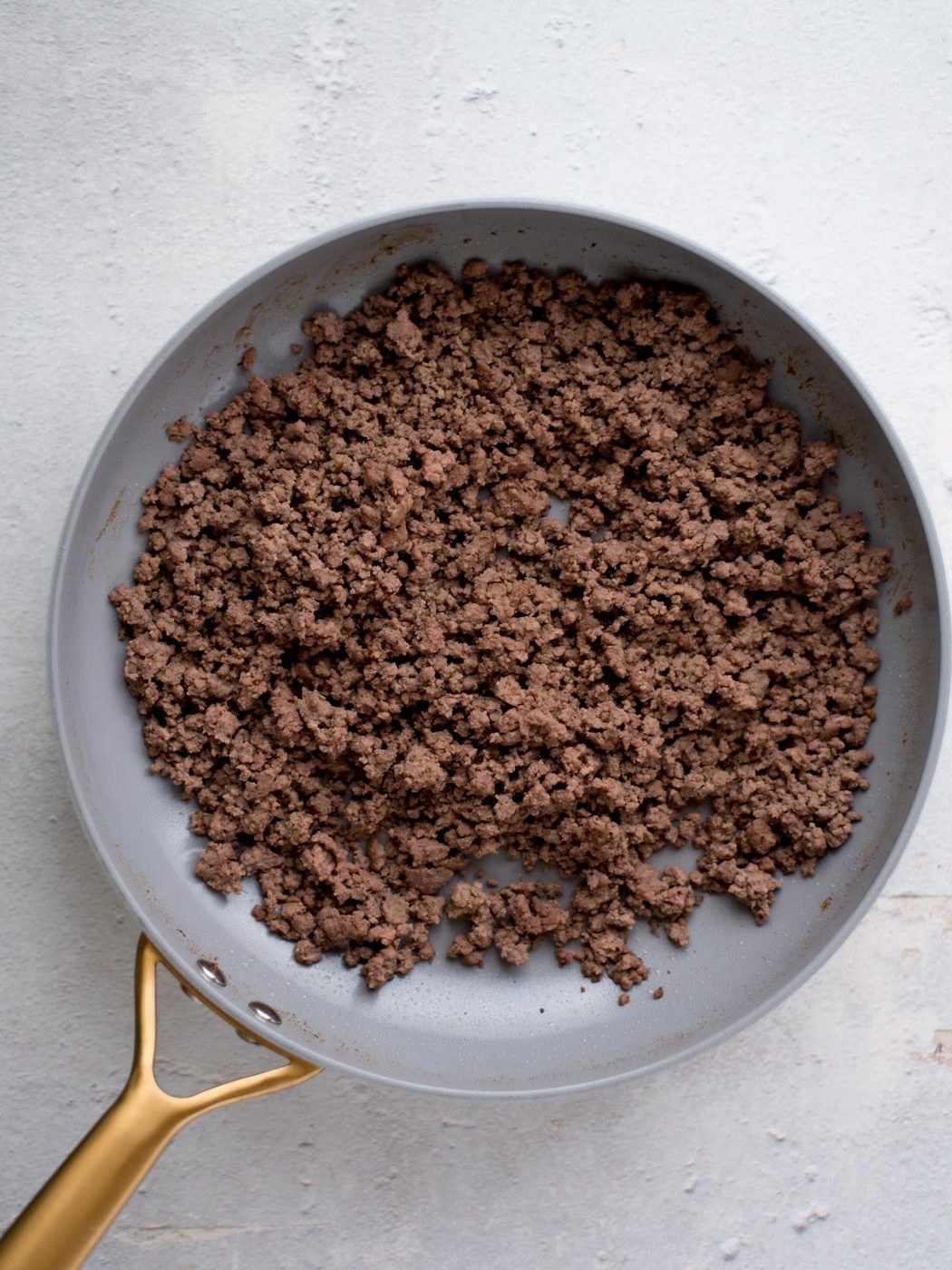 cooked ground beef in a skillet