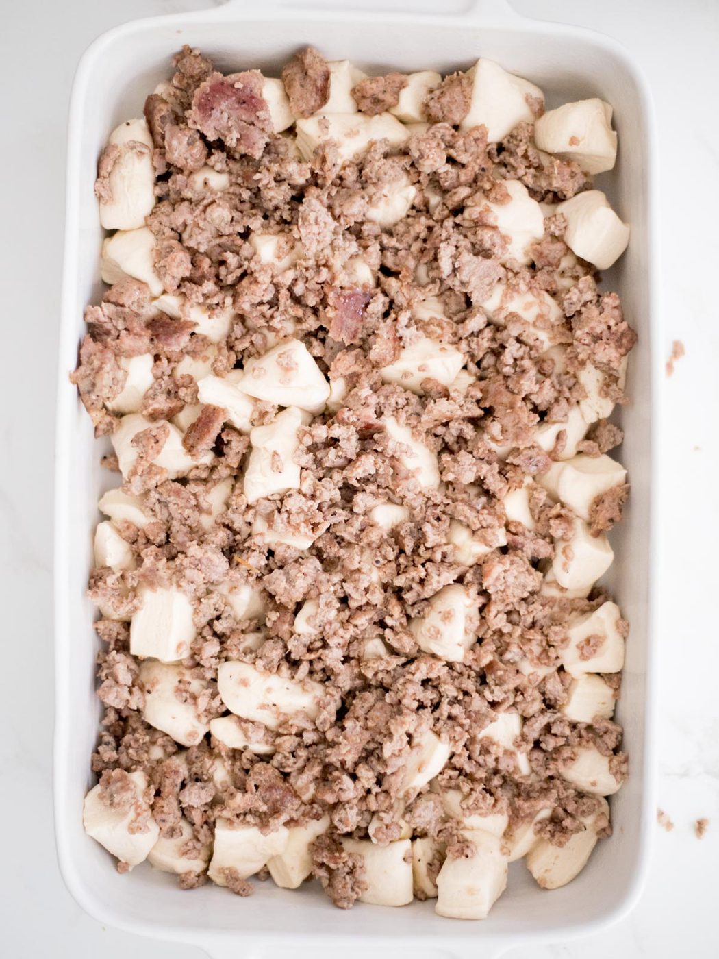 biscuits and breakfast sausage in casserole dish