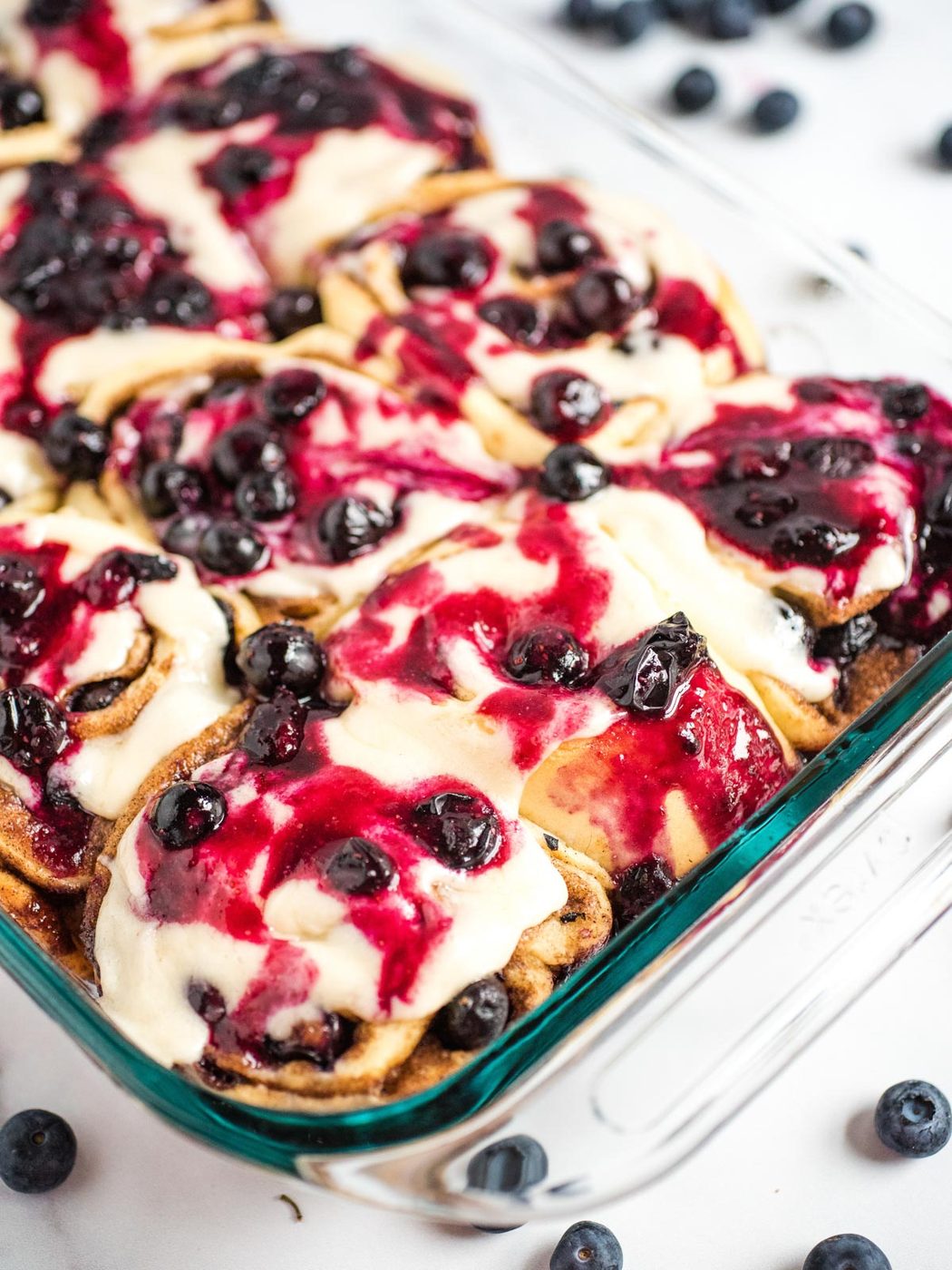clear pyrex with blueberry cinnamon rolls inside