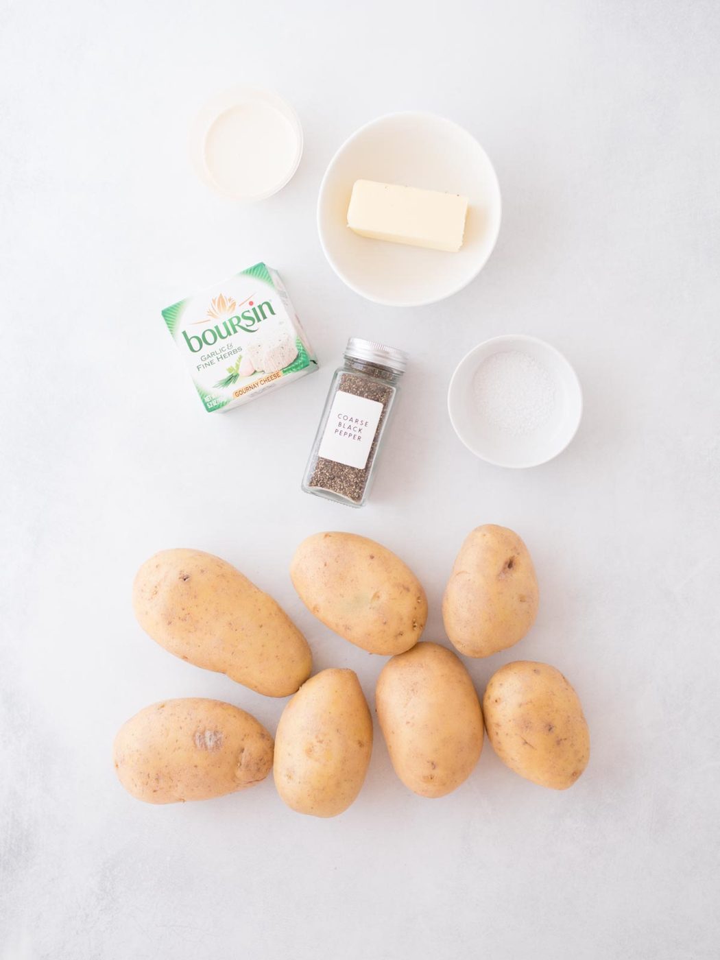 Ingredients shown that are needed to prepare boursin mashed potatoes.