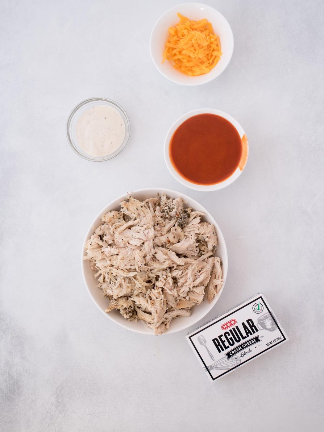 Ingredients needed to make Buffalo Chicken Dip.