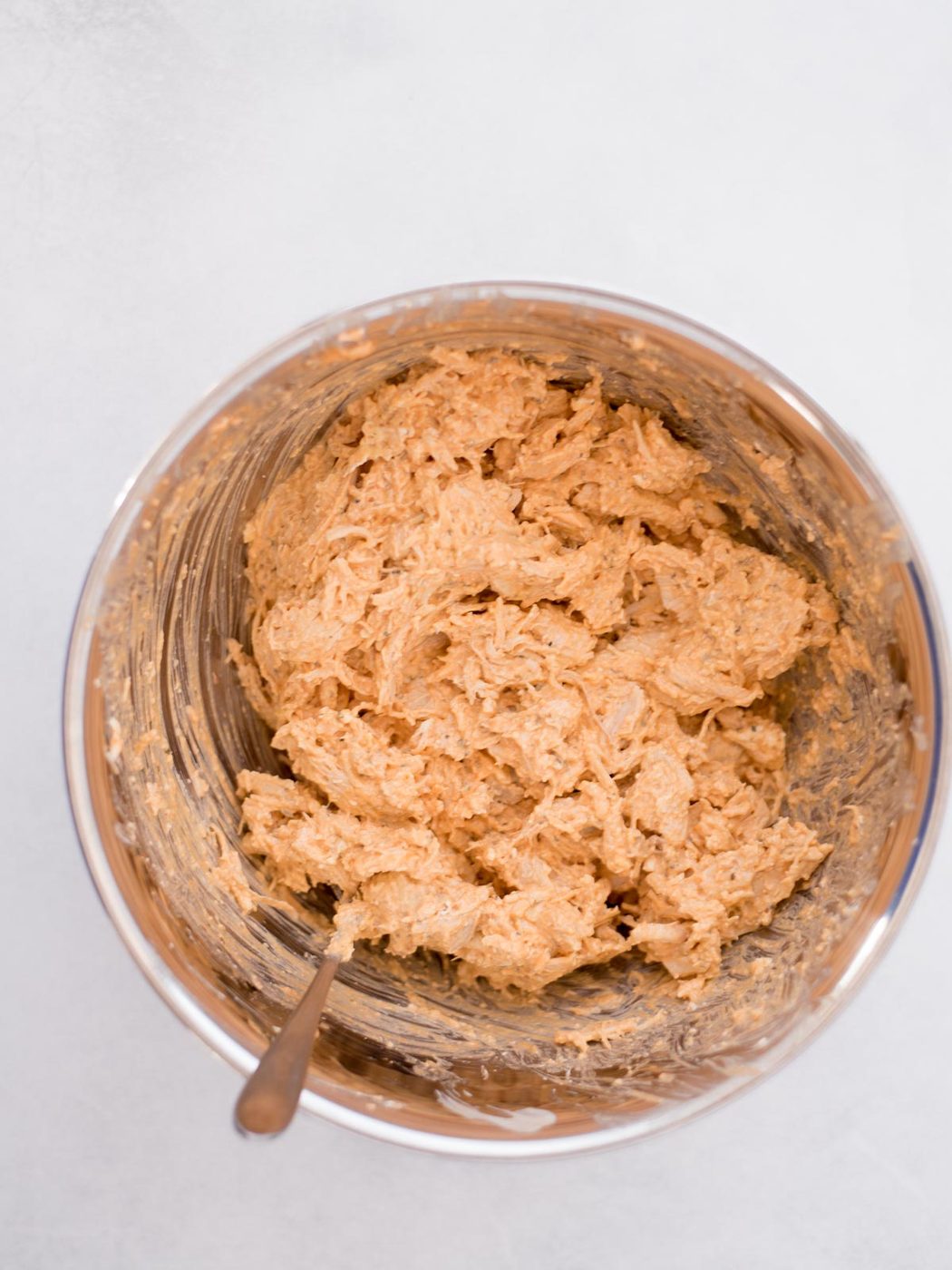 Mixing bowl with chicken mixture combined.