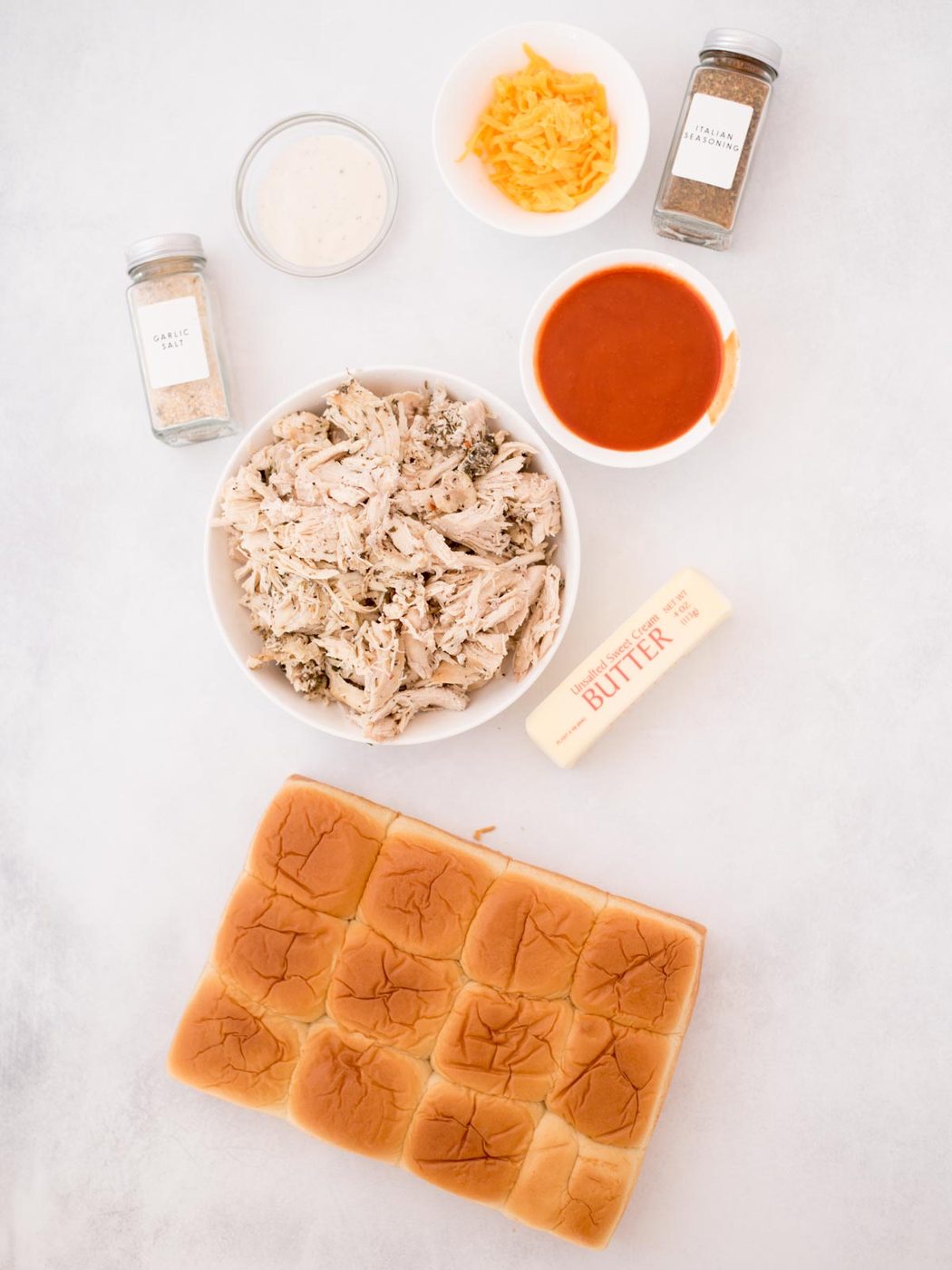 Ingredients shown are used to prepare buffalo chicken sliders.