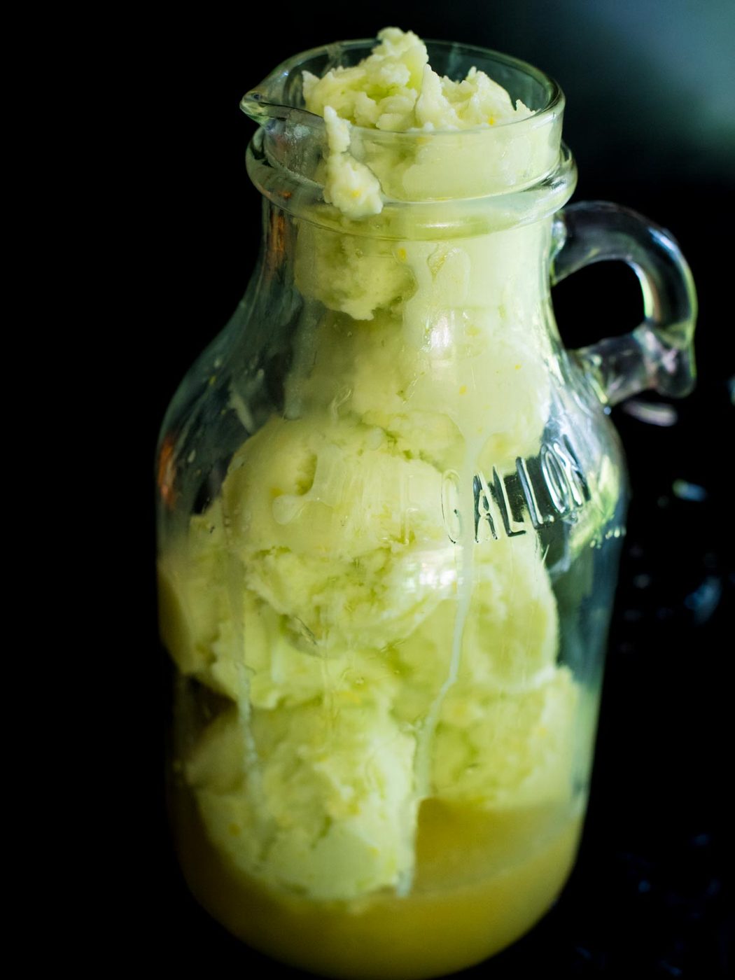 lime sherbet added to the limeade in a pitcher