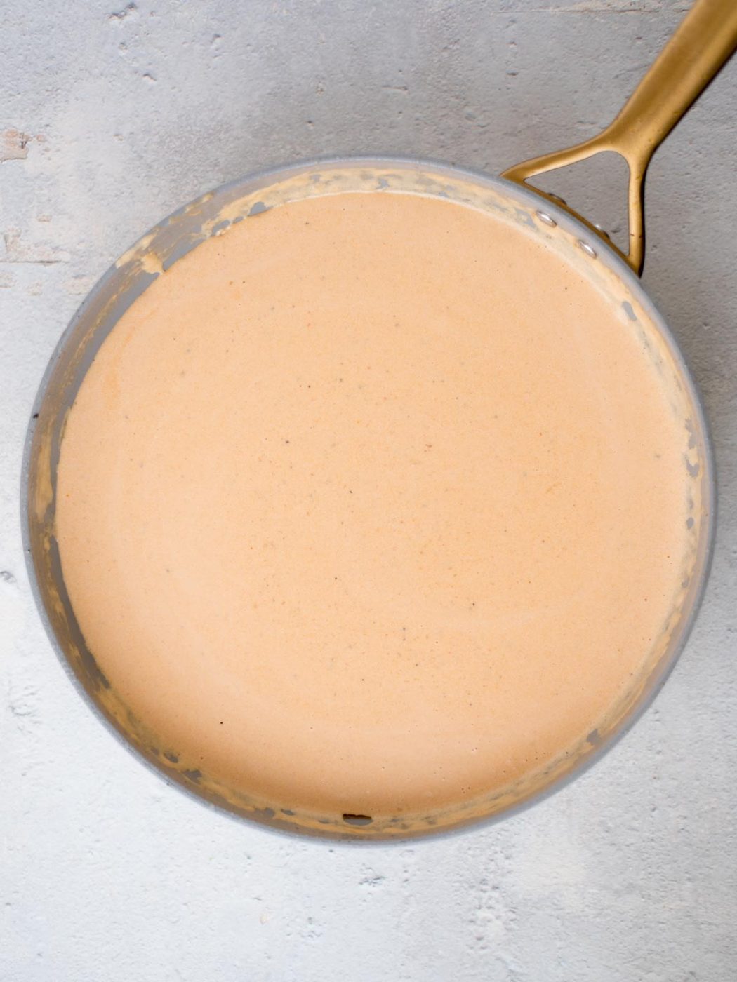 creamy cajun chicken pasta sauce in a skillet