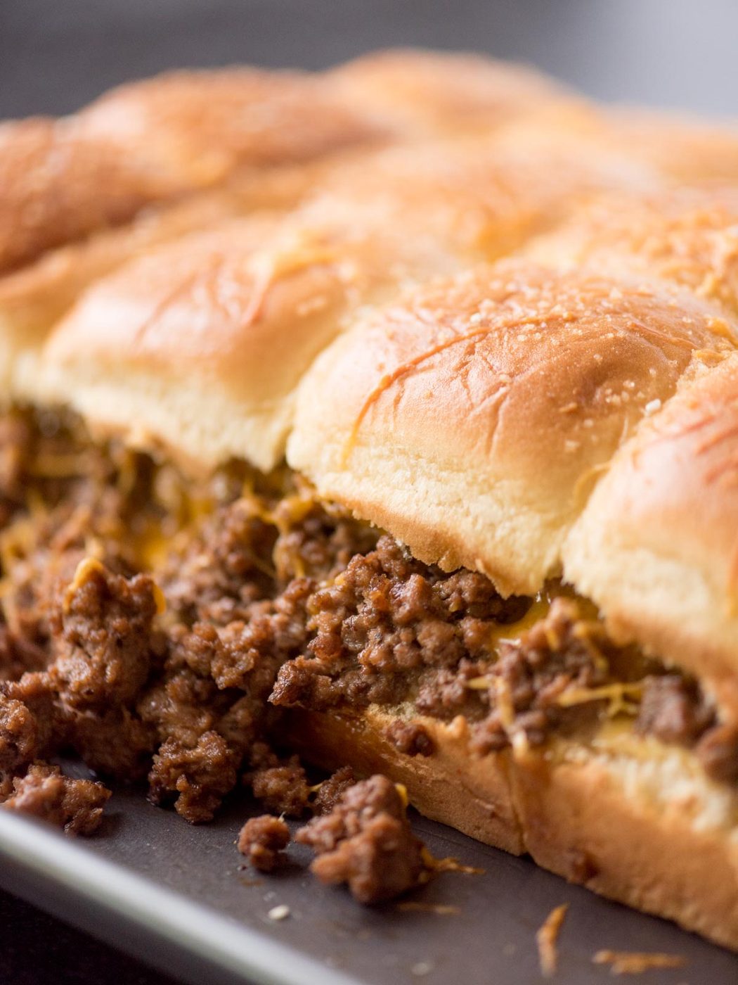 cheeseburger sliders on a baking sheet