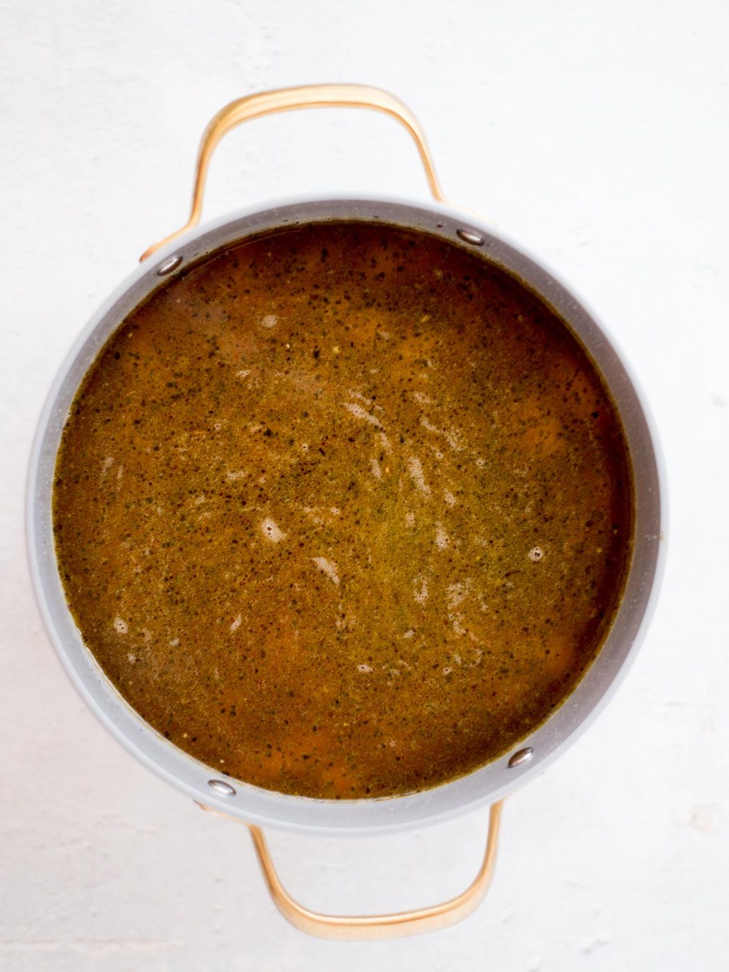 beef stock and potatoes added to the cheeseburger soup pot