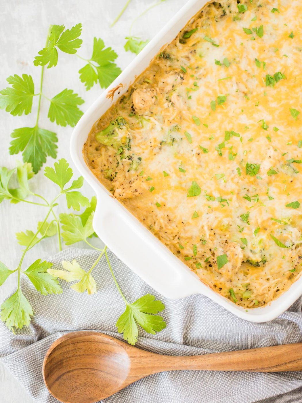casserole in a white dish with a wooden spoon