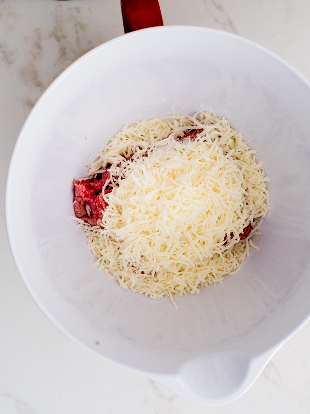 ingredients for cheesy ranch burgers in a mixing bowl