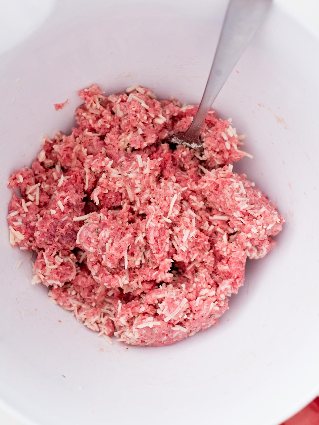 ingredients for cheesy ranch burgers mixed together in a bowl