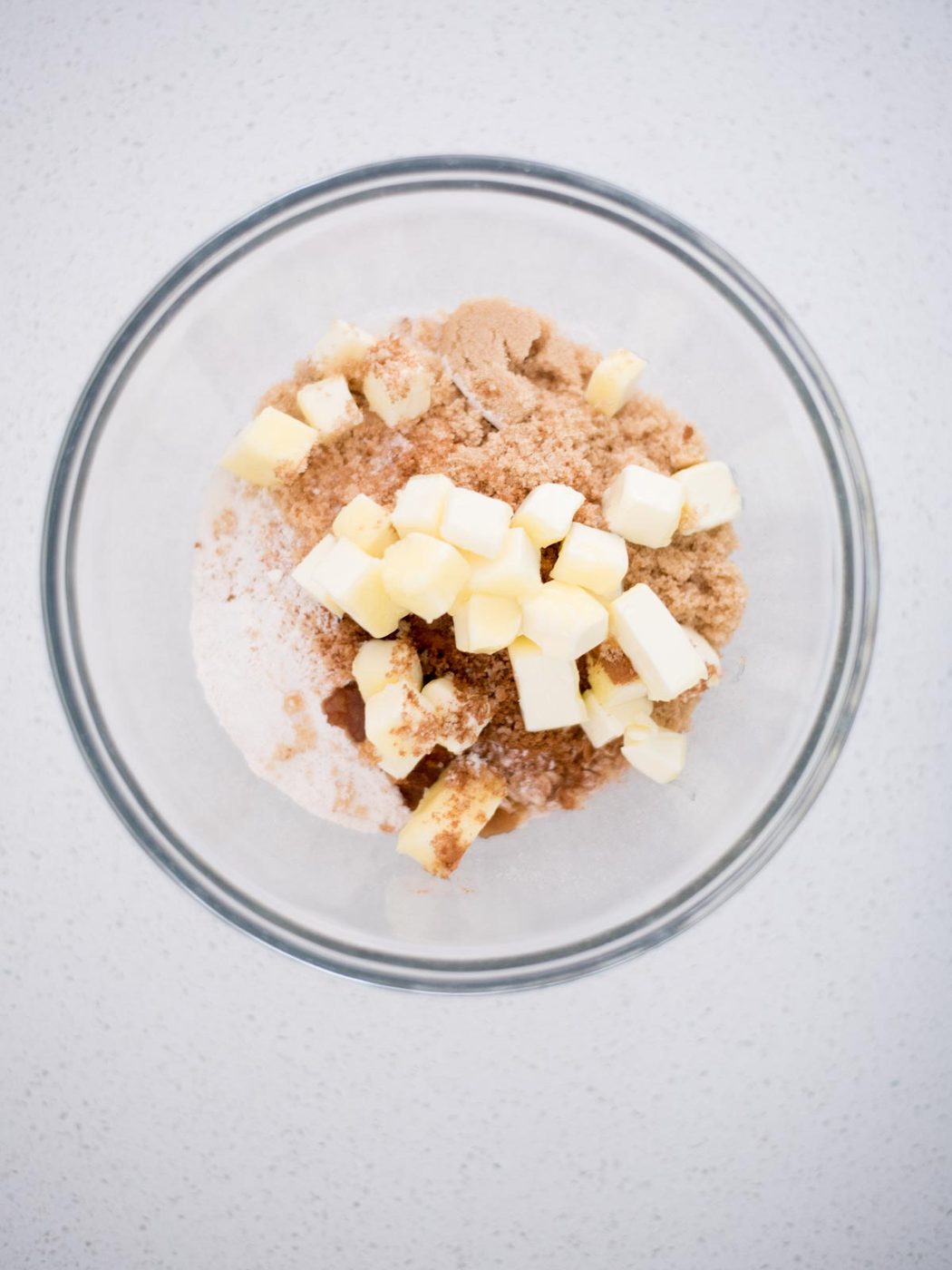 butter added to crisp ingredients in a mixing bowl