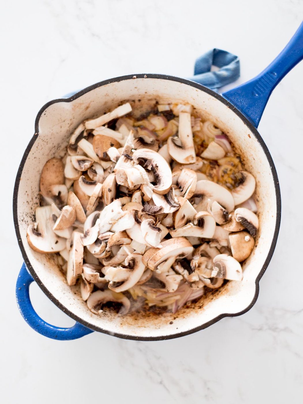 sliced mushrooms in a skillet