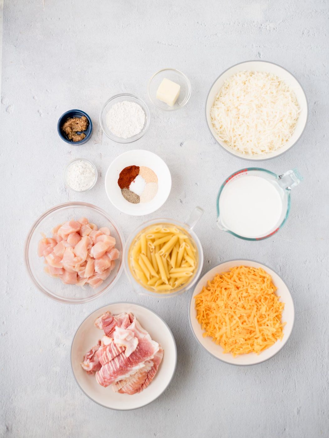 Ingredients shown are used to prepare chicken bacon ranch pasta.