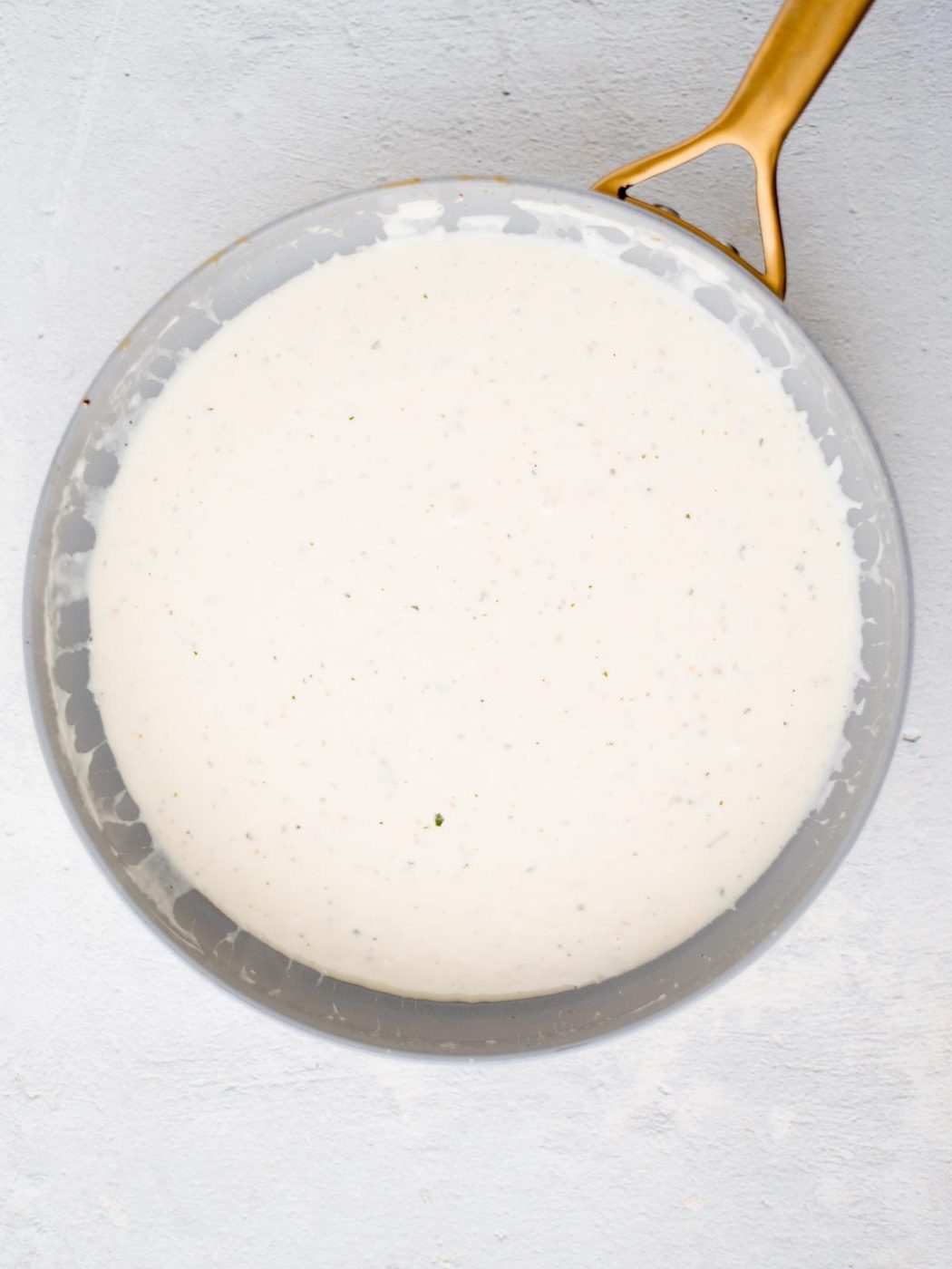 White sauce in a skillet.