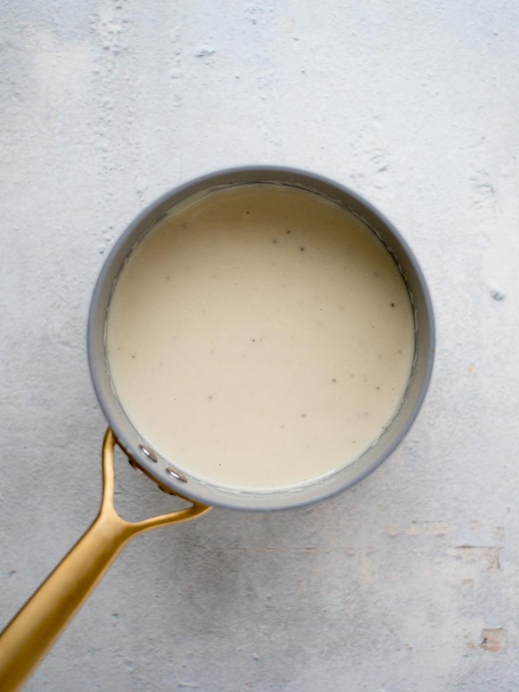 creamy Dijon Parmesan sauce in a saucepan