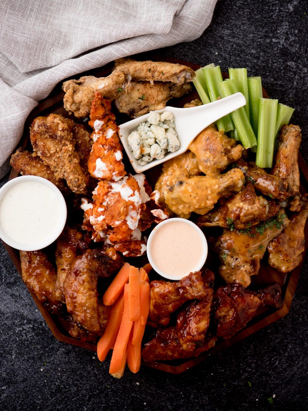 chicken wing charcuterie board surrounded by a dish towel