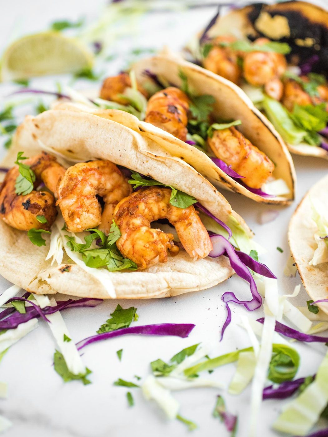 side shot of chili lime shrimp tacos