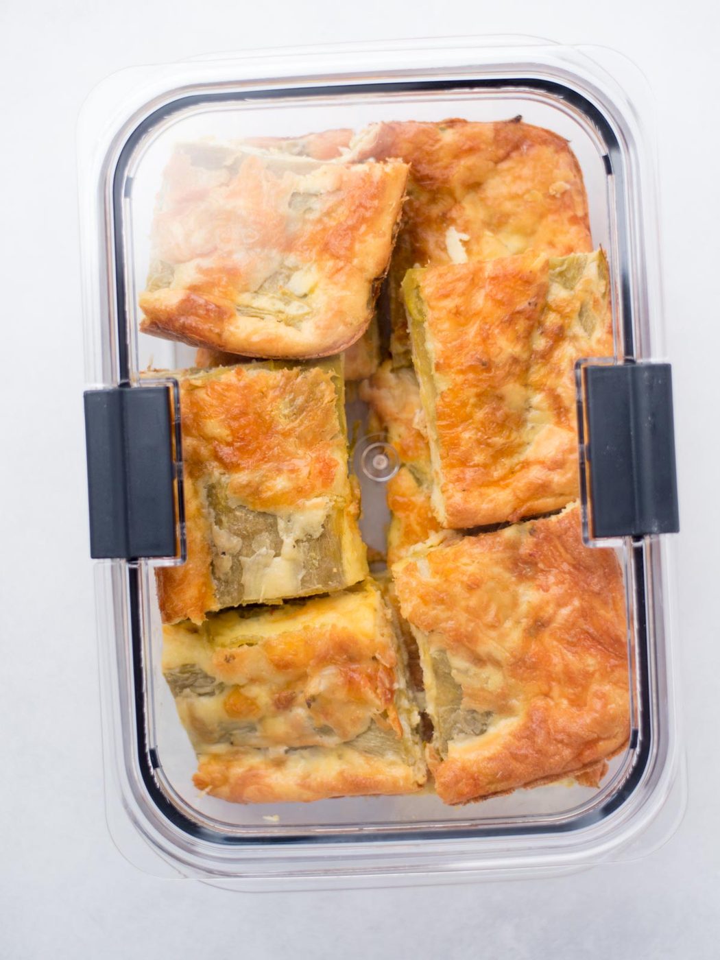 Leftover hatch chile relleno slices in an airtight container.