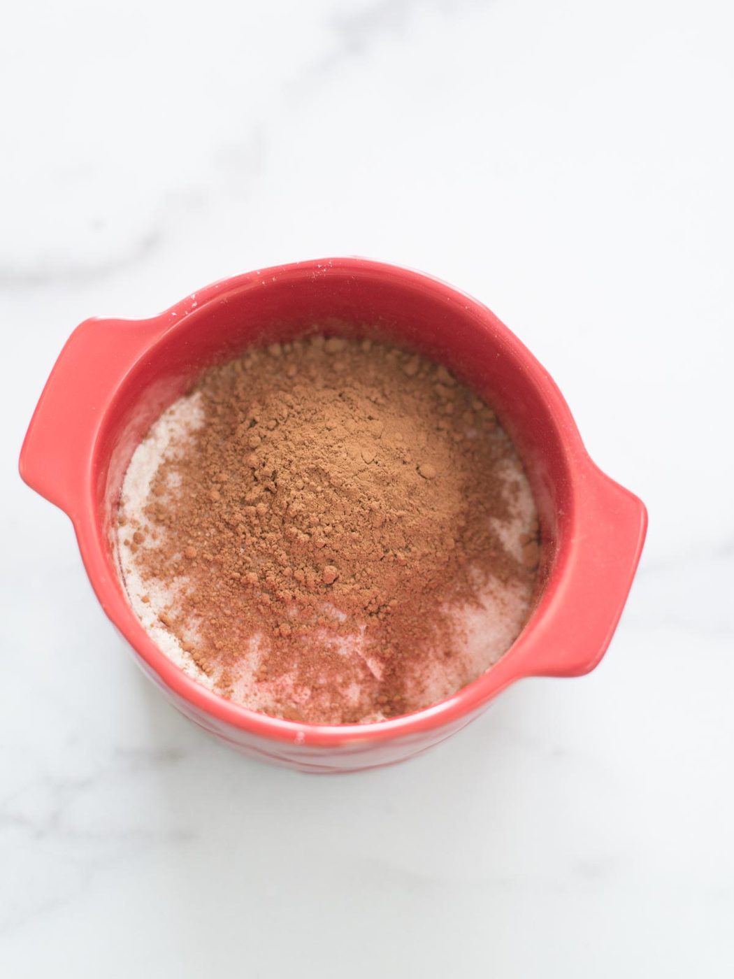 cocoa powder added to mug