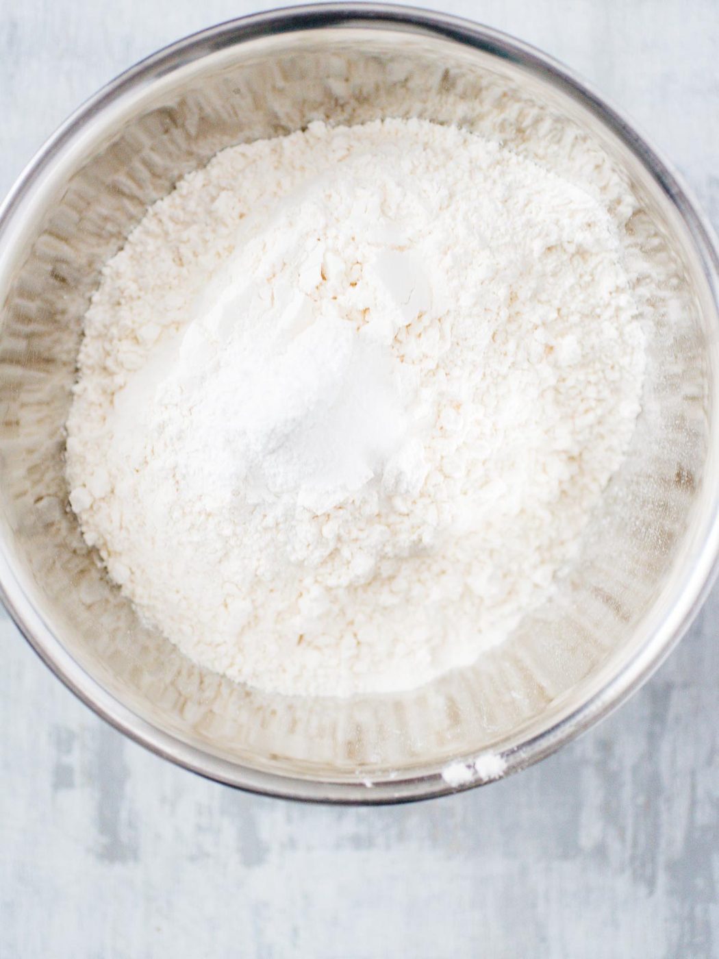 dry ingredients mixed together in a bowl for sugar cookies