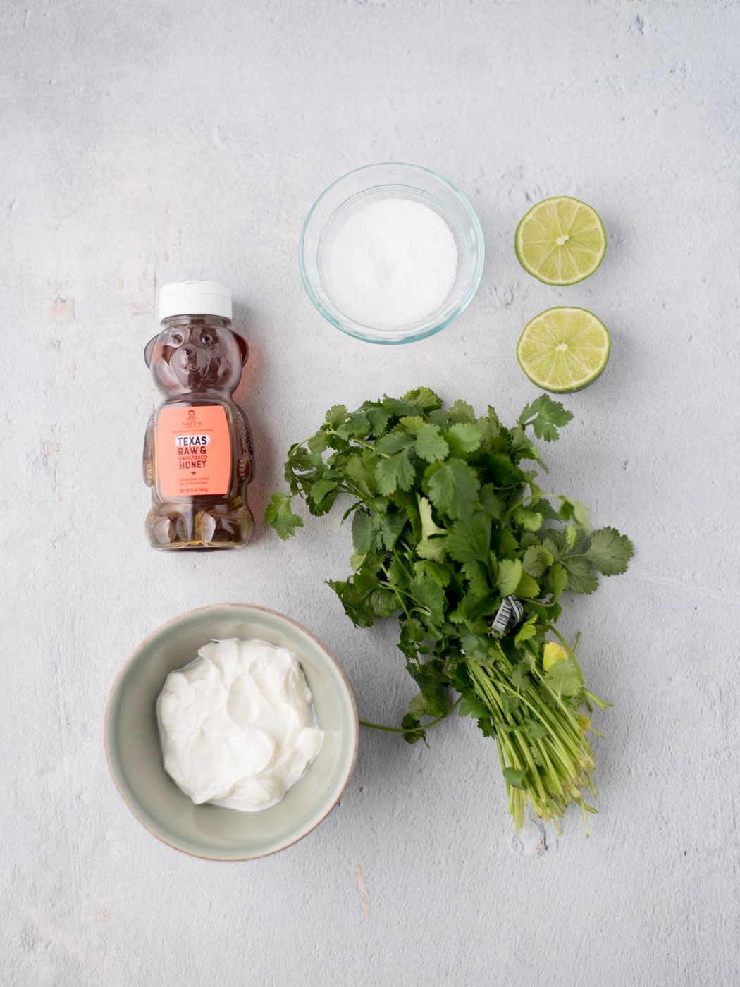 Ingredients shown are used to prepare the cilantro lime sauce.