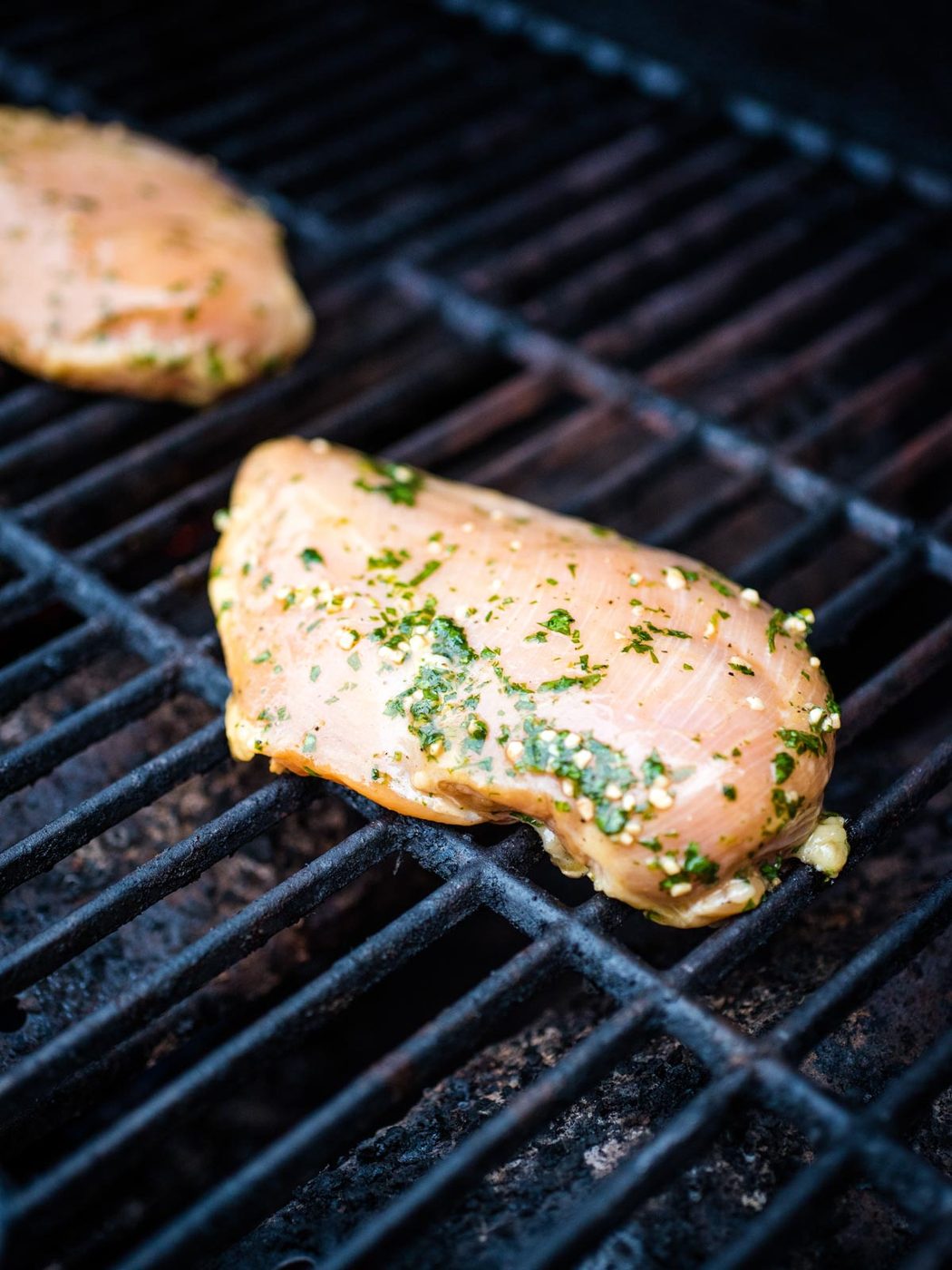 seasoned marinated chicken on grill
