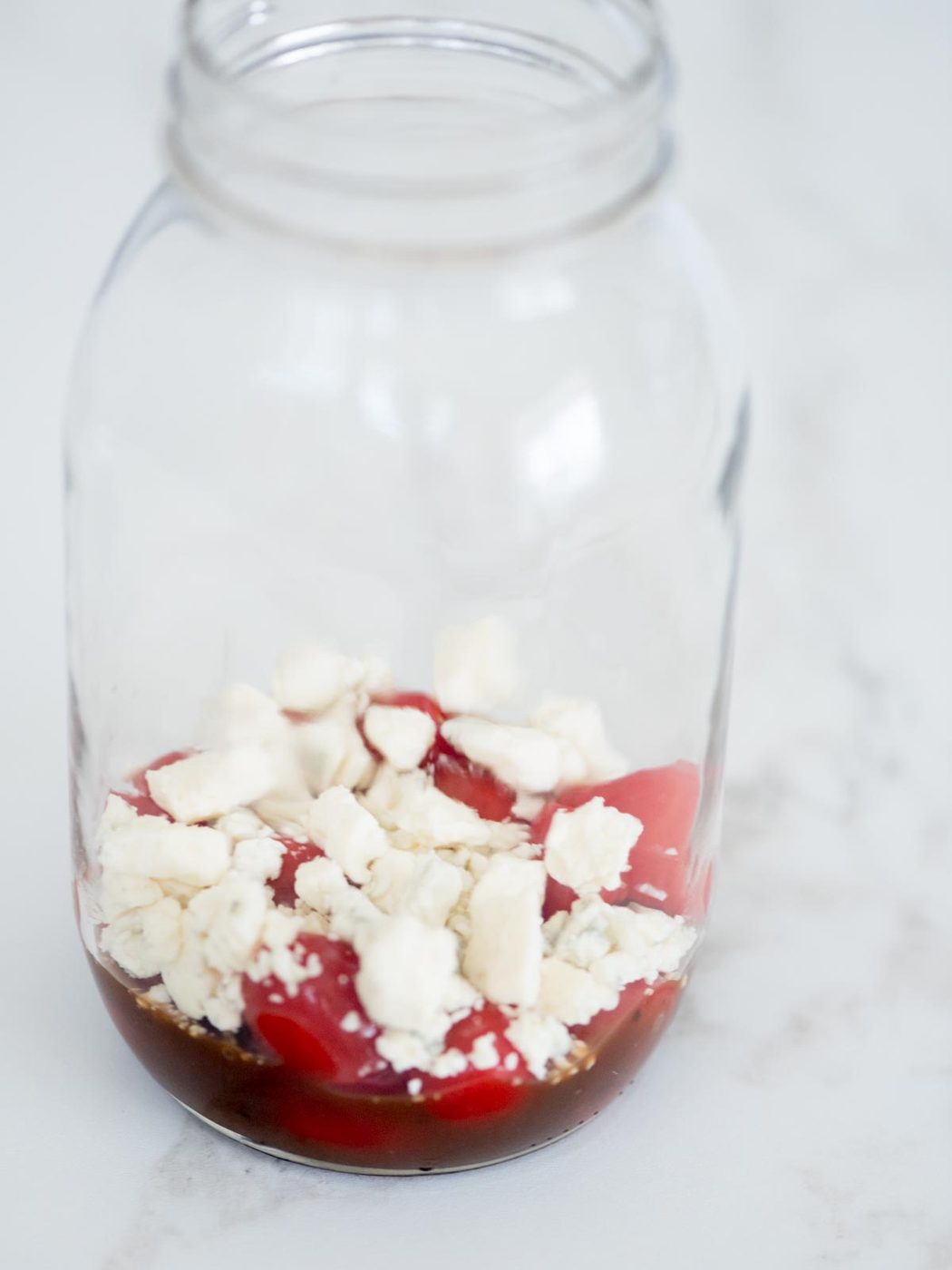 balsamic vinaigrette, tomatoes, gorgonzola in a mason jar